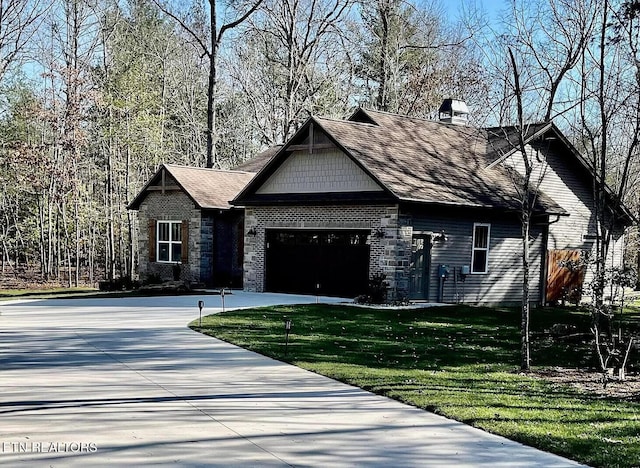 view of front of property with a garage and a front yard