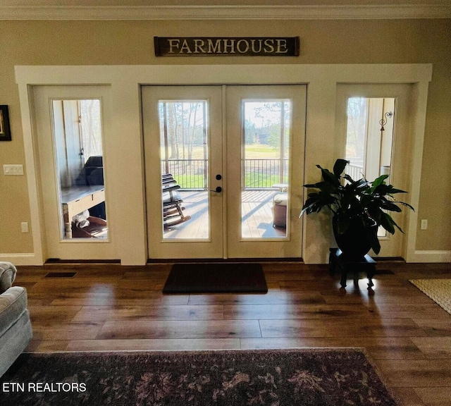 doorway to outside with dark hardwood / wood-style flooring, crown molding, and french doors