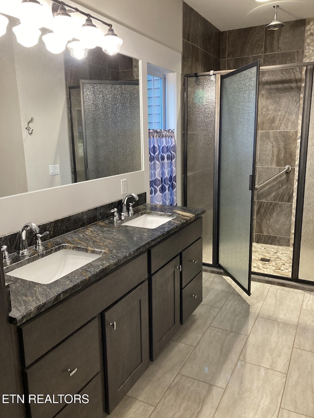 bathroom with vanity and an enclosed shower