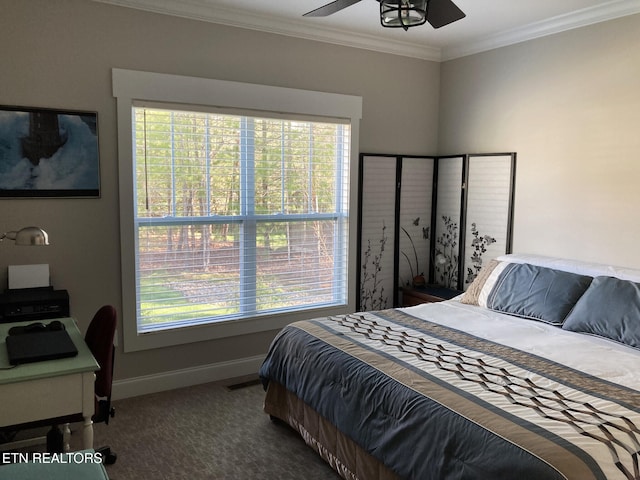 carpeted bedroom with ornamental molding and ceiling fan