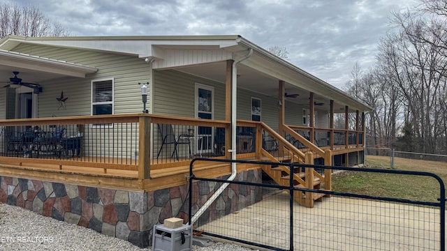 exterior space featuring ceiling fan and a porch