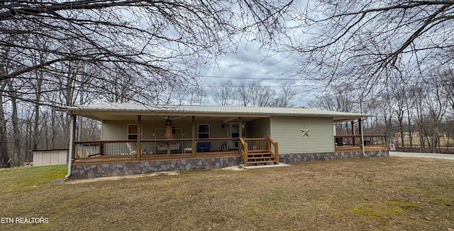 view of front facade with covered porch and a front lawn