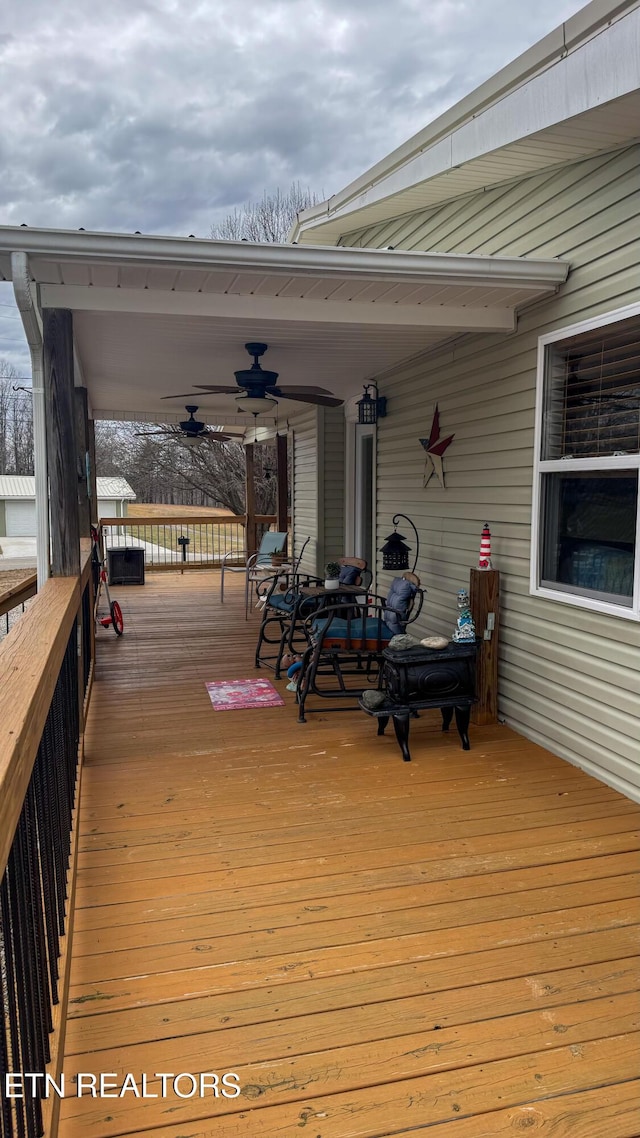 wooden deck with ceiling fan