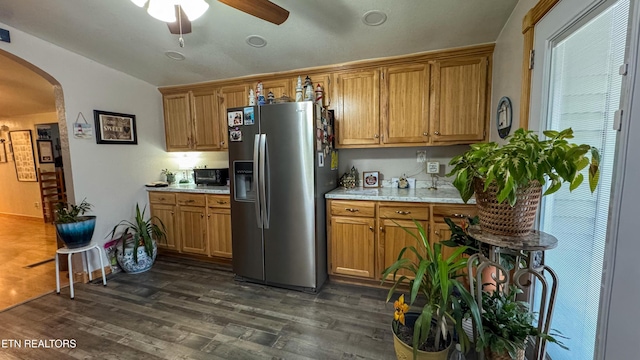 kitchen with dark hardwood / wood-style floors, stainless steel fridge, and ceiling fan