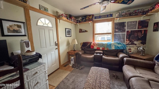 living room with hardwood / wood-style floors and ceiling fan