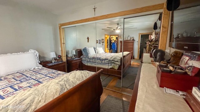 bedroom with hardwood / wood-style floors and a closet