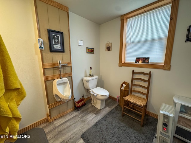 bathroom with wood-type flooring and toilet