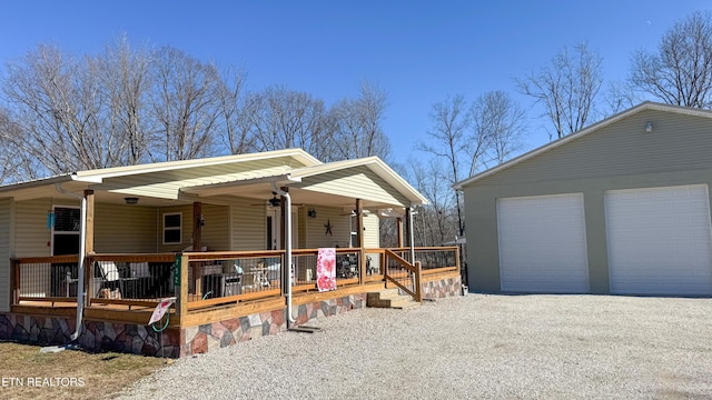 view of front facade with a garage and covered porch