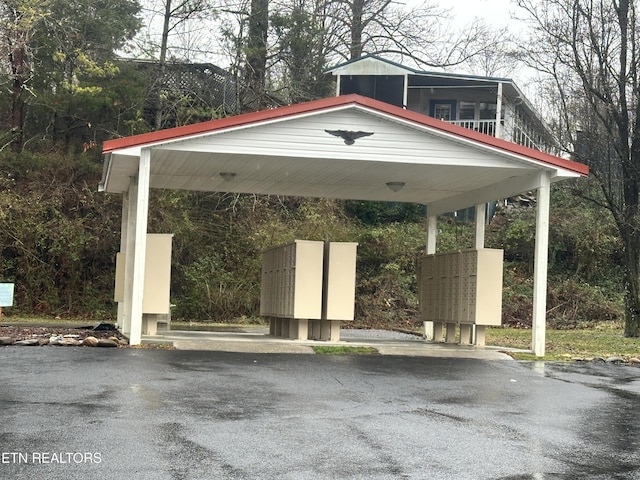 view of vehicle parking featuring a mail area