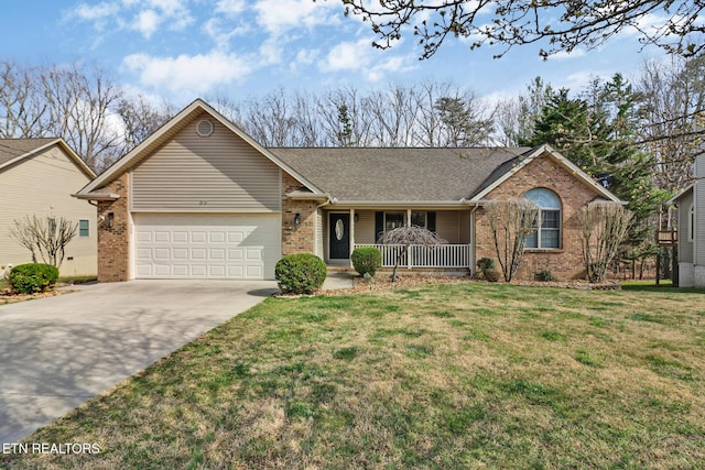 ranch-style home featuring brick siding, a front yard, covered porch, a garage, and driveway