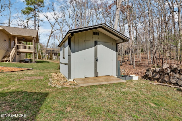 view of shed featuring stairway