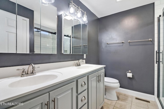 full bathroom with tile patterned flooring, toilet, visible vents, and a sink
