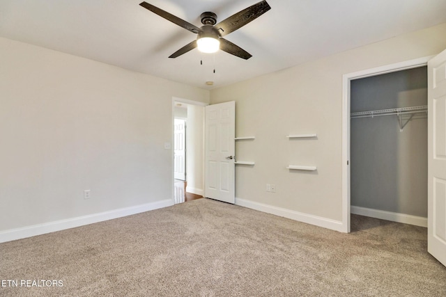 unfurnished bedroom featuring carpet flooring, baseboards, a closet, and ceiling fan