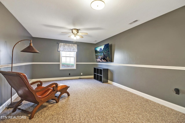 unfurnished room featuring carpet flooring, baseboards, visible vents, and ceiling fan