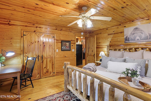 bedroom with wooden walls, wooden ceiling, and light wood-type flooring