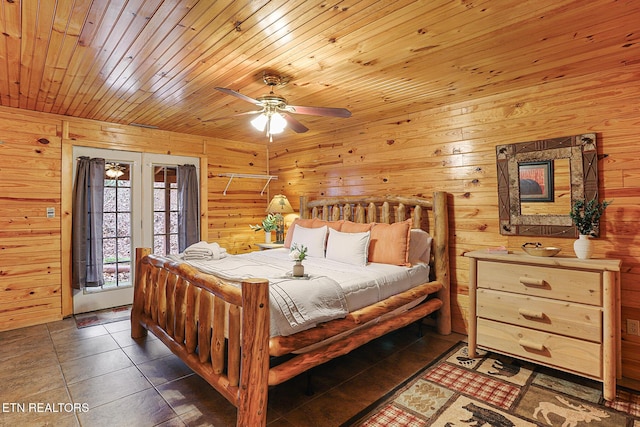 tiled bedroom with access to exterior, wooden walls, wooden ceiling, and ceiling fan