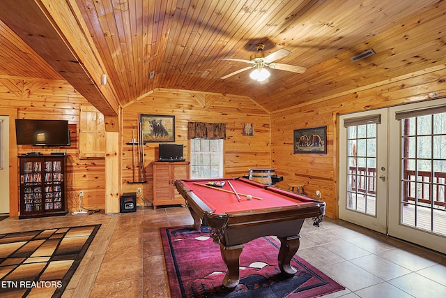 recreation room with lofted ceiling, wooden walls, wooden ceiling, tile patterned floors, and french doors