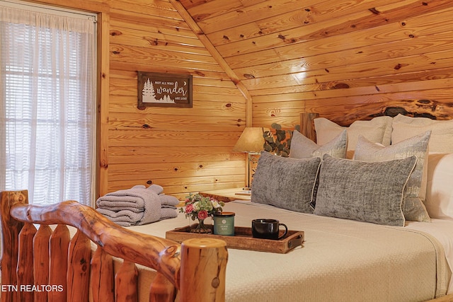 bedroom with wooden ceiling and wood walls