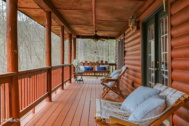 wooden terrace featuring ceiling fan