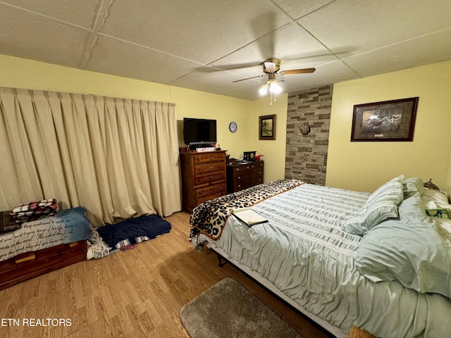 bedroom featuring ceiling fan and light hardwood / wood-style flooring