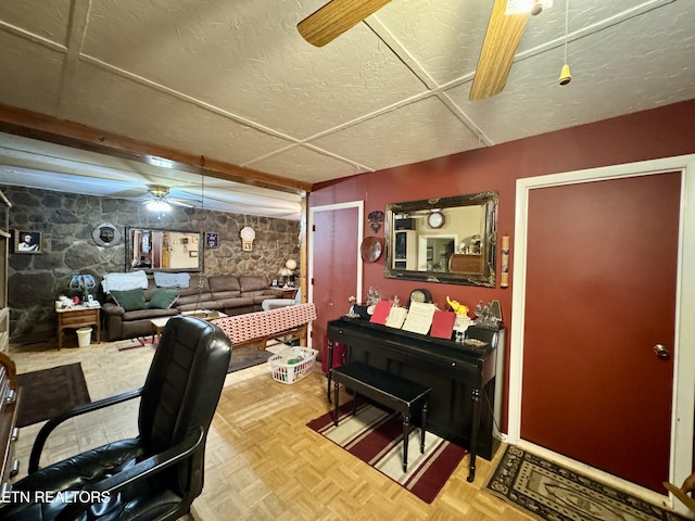 misc room with parquet flooring and ceiling fan