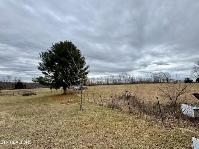 view of yard with a rural view