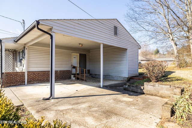 exterior space featuring a carport