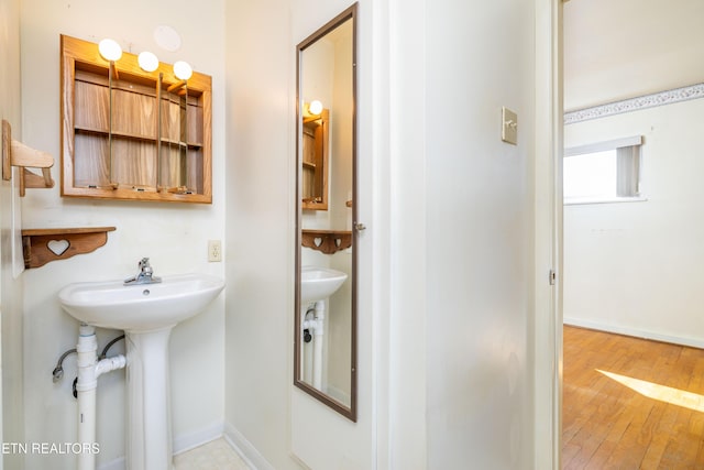 bathroom featuring hardwood / wood-style floors and sink