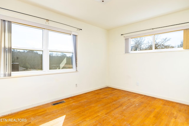 empty room featuring hardwood / wood-style floors