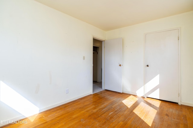 unfurnished bedroom with light hardwood / wood-style flooring