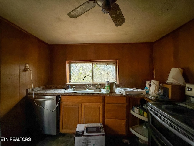 kitchen featuring electric stove, sink, ceiling fan, wooden walls, and stainless steel dishwasher