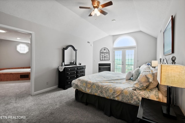 carpeted bedroom featuring multiple windows, vaulted ceiling, access to exterior, and french doors