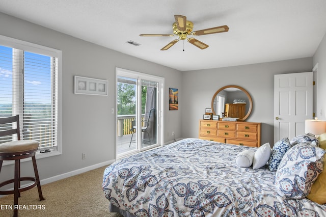 carpeted bedroom featuring ceiling fan and access to exterior