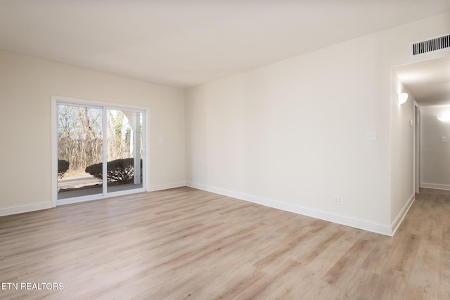 unfurnished room featuring light hardwood / wood-style flooring