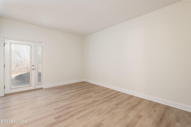 unfurnished room with light hardwood / wood-style flooring