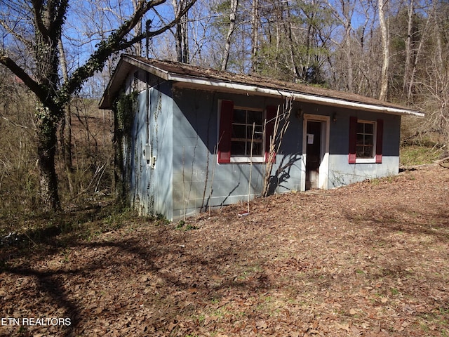 view of front of home featuring concrete block siding