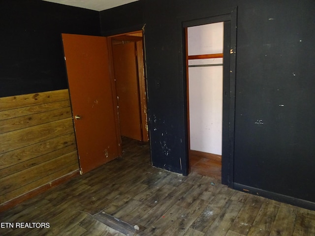 unfurnished bedroom featuring dark wood-style floors