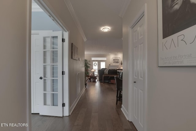 corridor with crown molding and dark hardwood / wood-style floors