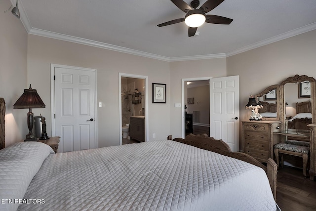 bedroom with crown molding, dark wood-type flooring, ensuite bathroom, and ceiling fan