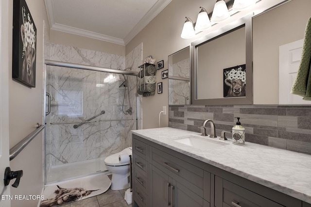 bathroom featuring crown molding, backsplash, vanity, an enclosed shower, and toilet