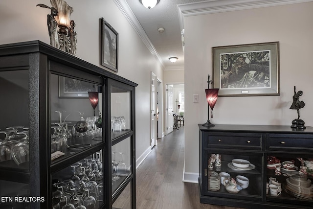 corridor featuring crown molding and dark hardwood / wood-style floors