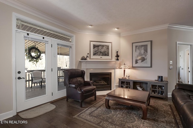 living area featuring dark hardwood / wood-style flooring, crown molding, and a textured ceiling