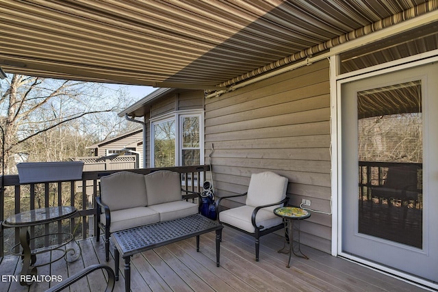 wooden deck featuring an outdoor hangout area