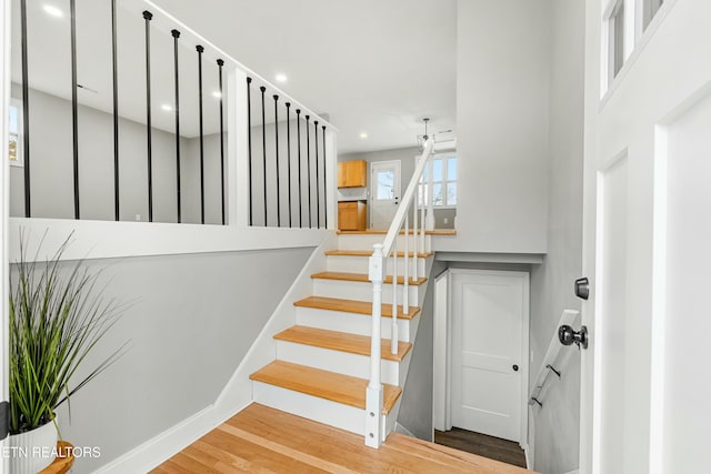 staircase with wood-type flooring