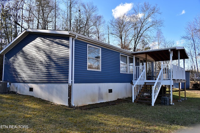 view of side of property with cooling unit and a lawn