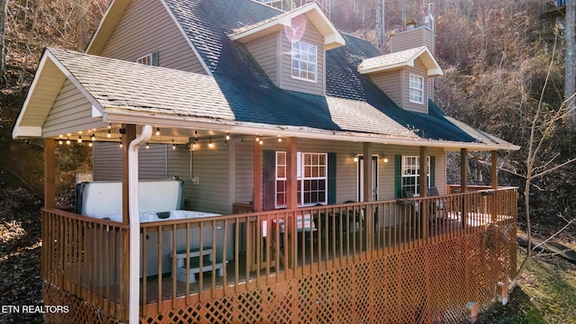 view of property exterior featuring a wooden deck and covered porch