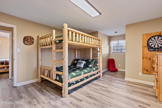 bedroom featuring wood-type flooring