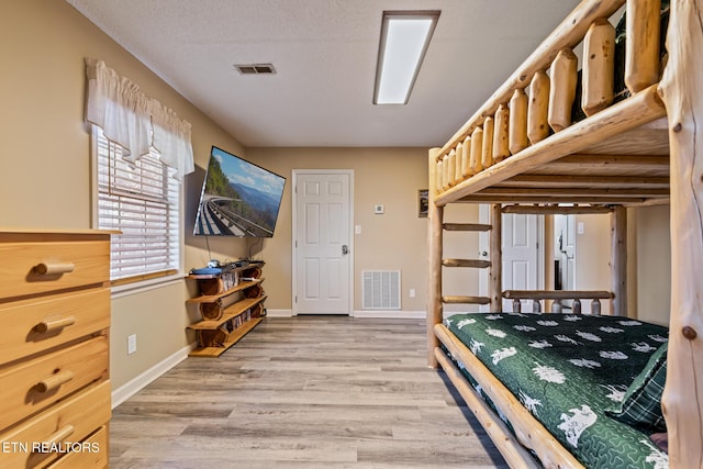 bedroom featuring light wood-type flooring