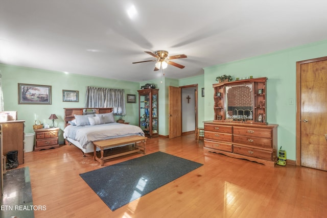 bedroom featuring ceiling fan and light hardwood / wood-style floors