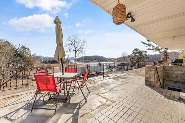 view of patio featuring a water view